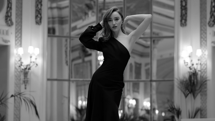 Phoebe Dynevor in a black dress