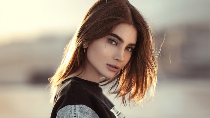 Brunette woman with brown hair and green eyes