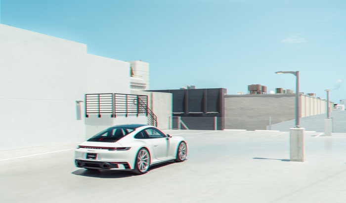 White Porsche 911 on a rooftop parking lot