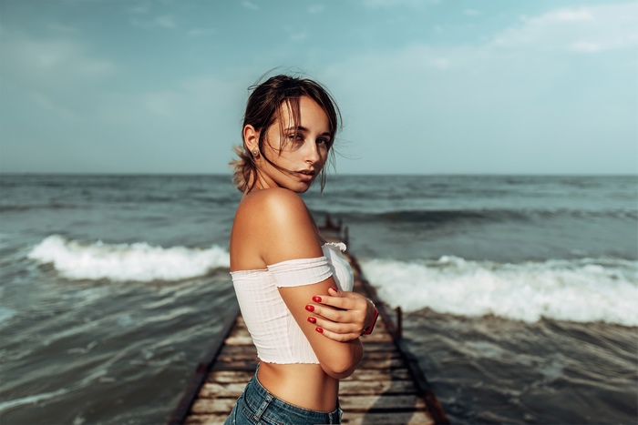 Woman on a pier at the ocean
