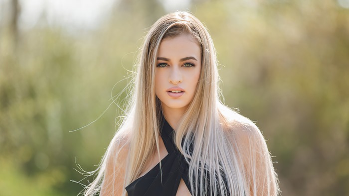 Blonde model in black dress