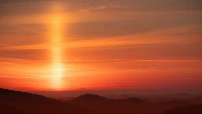 Orange sunset sky over hills 4K