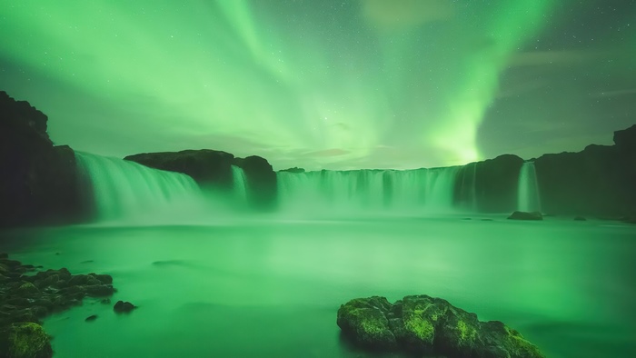 Waterfall in Iceland under Aurora Borealis 4K