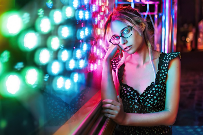 Girl with glasses in neon lights