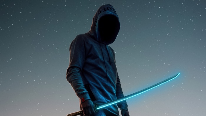 Hooded figure with glowing sword under starry sky
