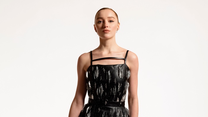 Phoebe Dynevor in a black dress
