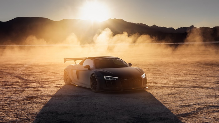 Black Audi R8 Sports Car in Desert at Sunset
