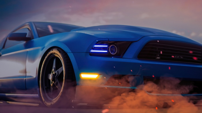 Blue Ford Mustang with smoke