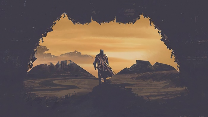 Batman in a desolate landscape framed by a bat symbol