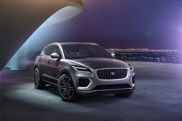 Jaguar E-Pace SUV parked at night with city lights