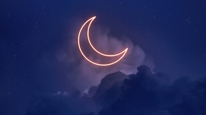 Neon crescent moon in a starry night sky