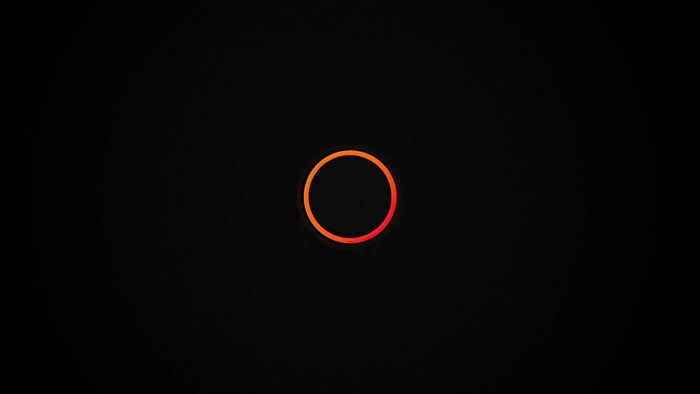 Orange and red circle on black background