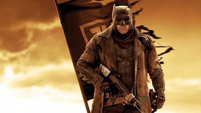 Batman from Justice League holding a rifle
