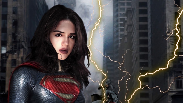 Sasha Calle as Supergirl with Batman in a ruined city