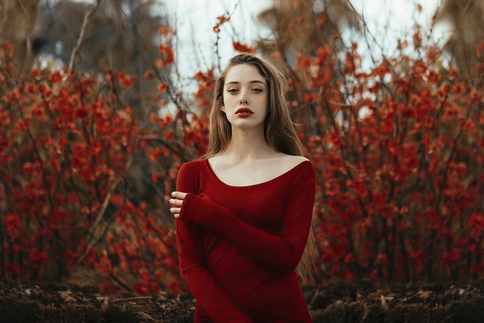 Model in a red dress with red flowers