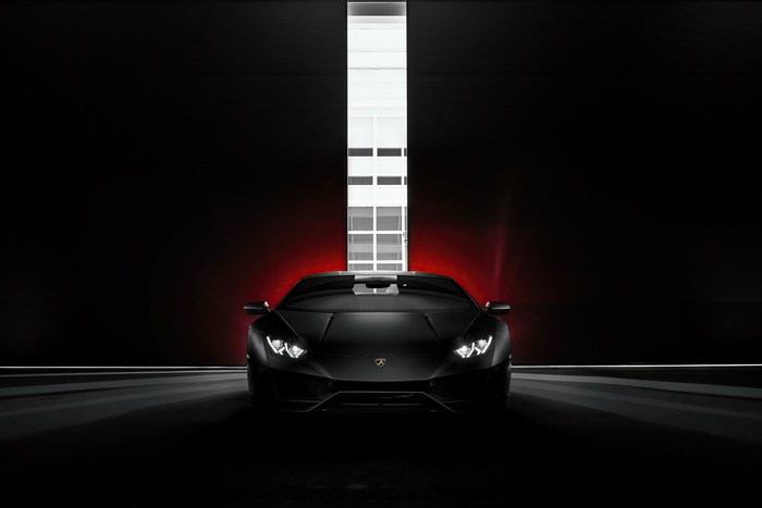 Black Lamborghini Huracan in a dark setting