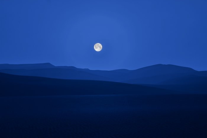 Full Moon Over Desert Hills at Night