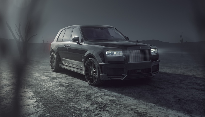 Black Rolls Royce Cullinan in a desolate landscape