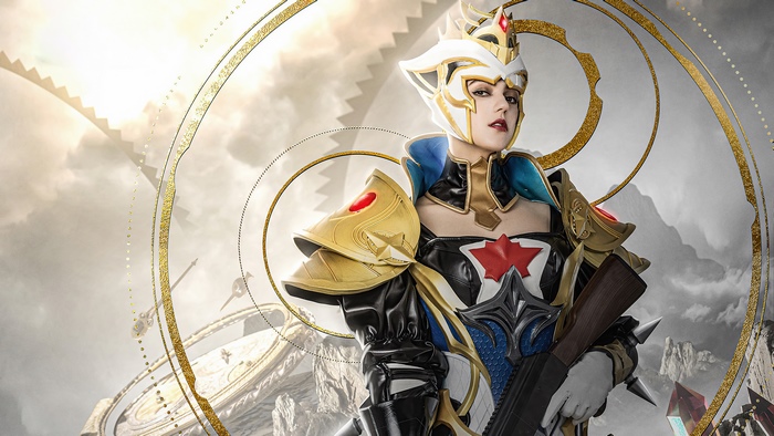 Cosplayer in elaborate armor holding a rifle