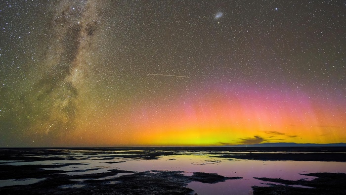 Milky Way and Aurora over water
