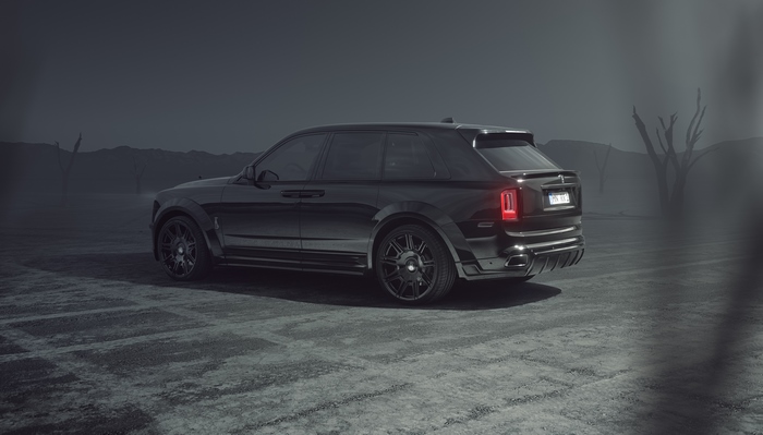 Black Rolls Royce Cullinan in a desolate landscape