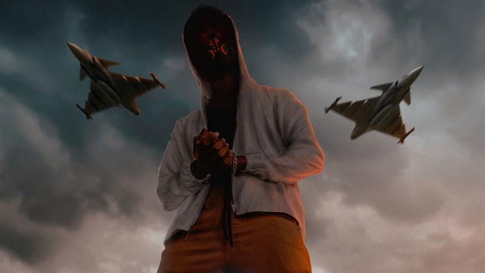Man with glowing mask and fighter jets