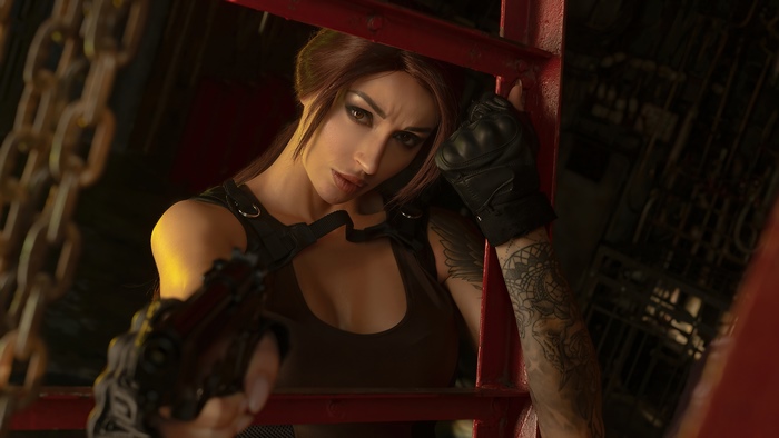 Lara Croft from Tomb Raider cosplay with gun