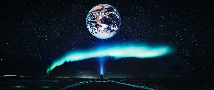 Earth and Aurora Borealis above a person