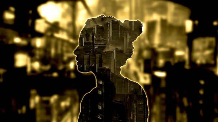 Silhouette of a woman with a cityscape inside