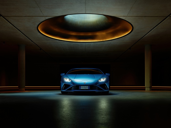 Blue Lamborghini Huracan Evo in a modern garage