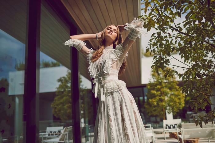 Josephine Skriver in a white lace dress