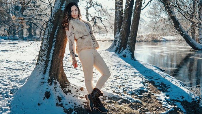 Winter Model Posing Near Snowy Trees