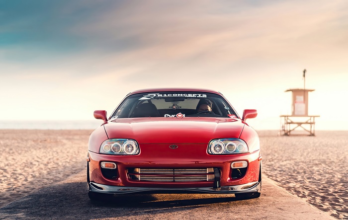 Red Toyota Supra on a Beach