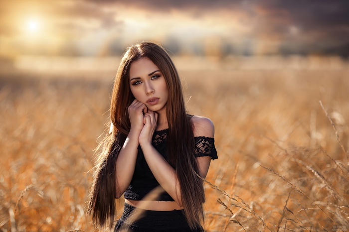 Model in a field at sunset 4K