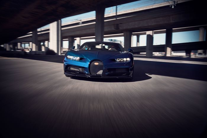 Blue Bugatti Chiron Pur Sport driving under bridge
