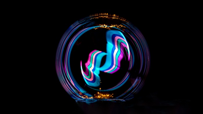 Abstract colorful light streaks in a bubble 4K