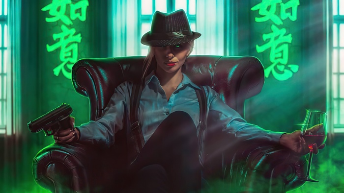 Woman in fedora with gun and wine