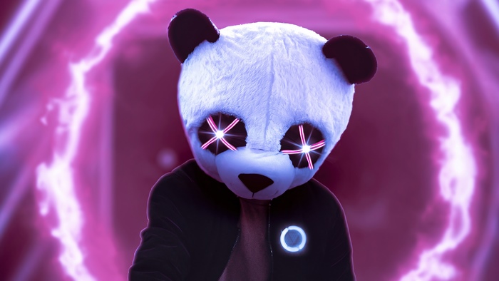 Panda artist with glowing eyes and a circular emblem