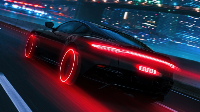 Black Porsche 911 with neon red accents on a highway at night