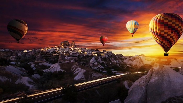 Hot air balloons over Cappadocia at sunset