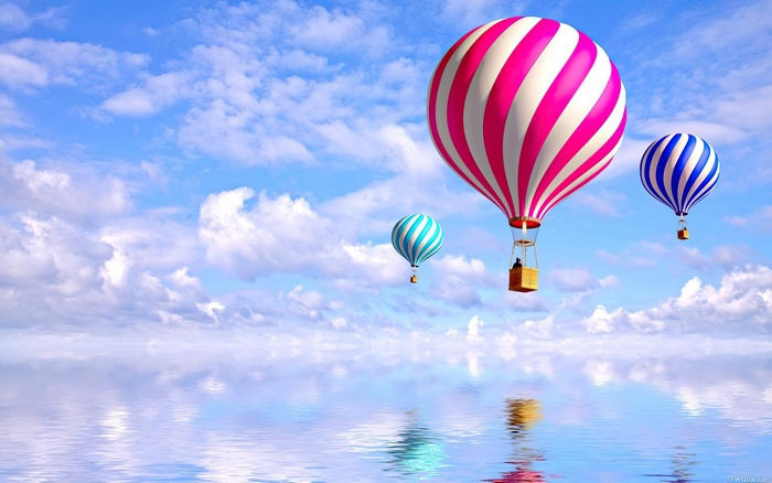 Hot air balloons over water