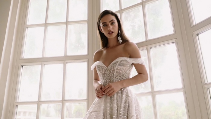 Yael Shelbia in a white off-the-shoulder dress