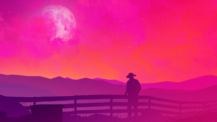 Cowboy looking at a pink moon over mountains
