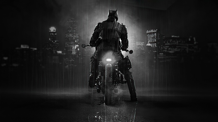 Batman on a motorcycle in the rain
