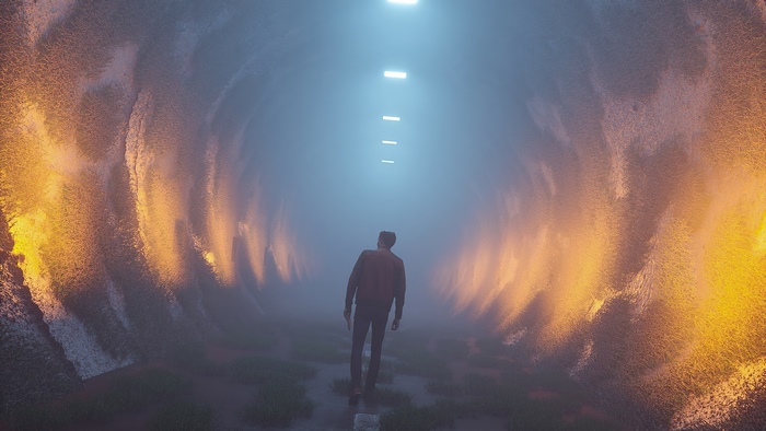 Man walking through a foggy tunnel with orange lights