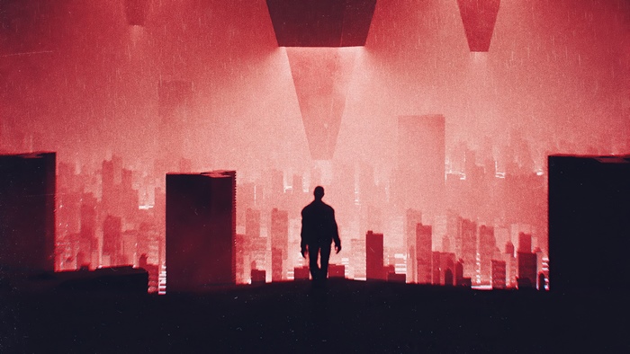 Silhouette of a man in a red, foggy city