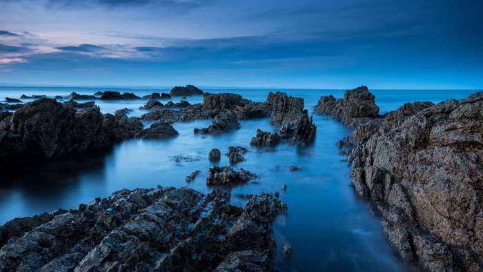 Sea and rocks at dusk
