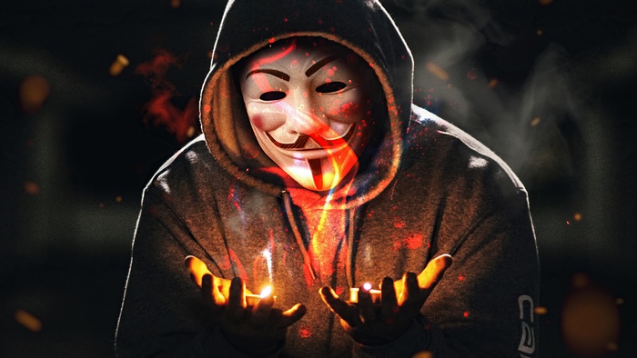 Anonymous mask with fire and candles 4K