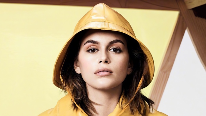 Kaia Gerber in yellow raincoat and hat