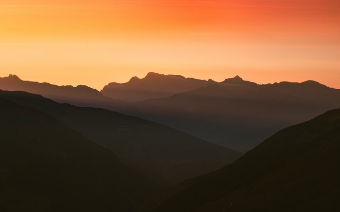 Mountain range silhouette at sunset